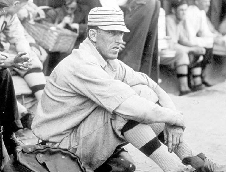 1930_Man sitting on floor watching Detroit Tigers game 1930_Man sitting on floor watching Detroit Tigers game