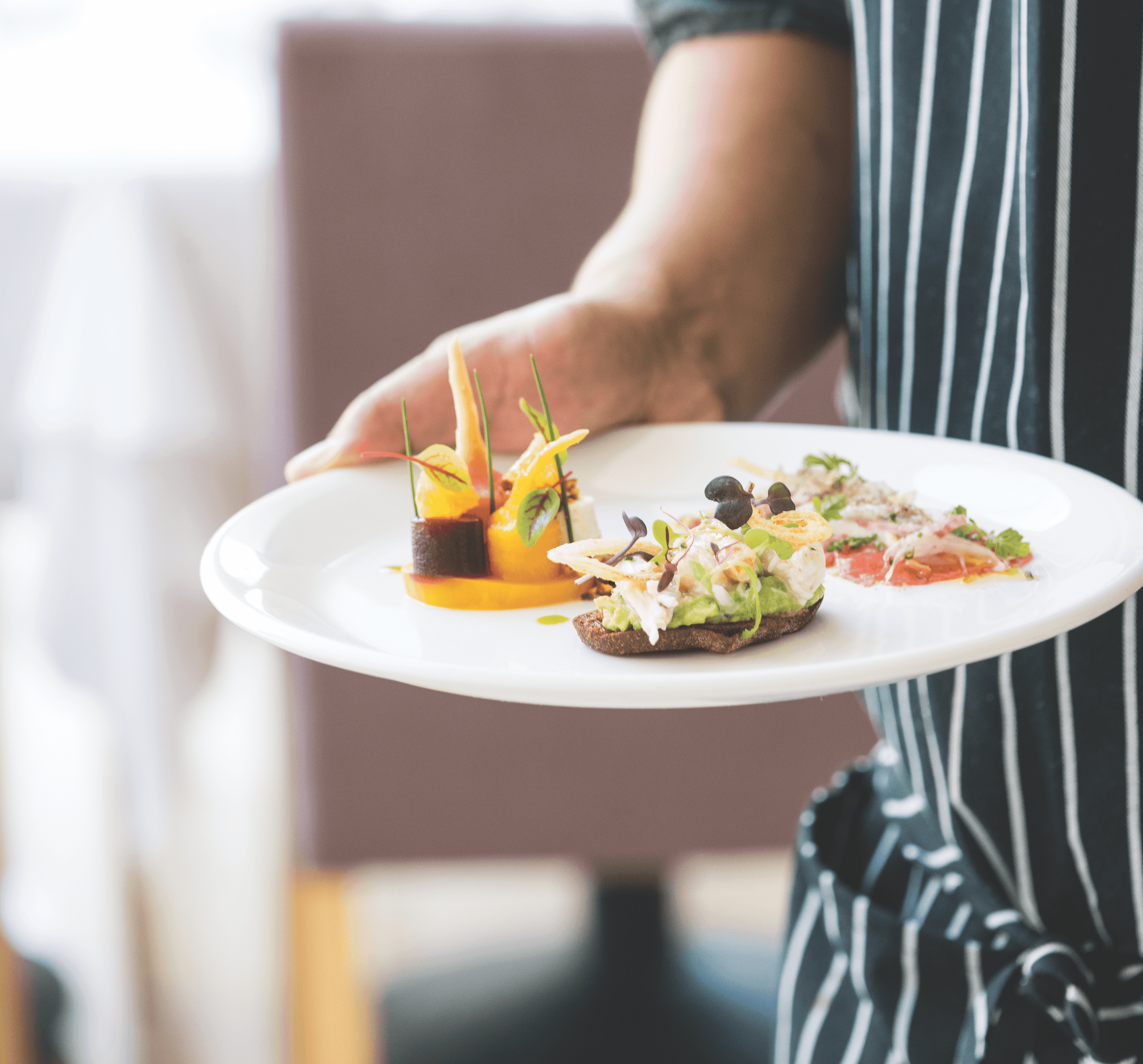 Chef carrying plate