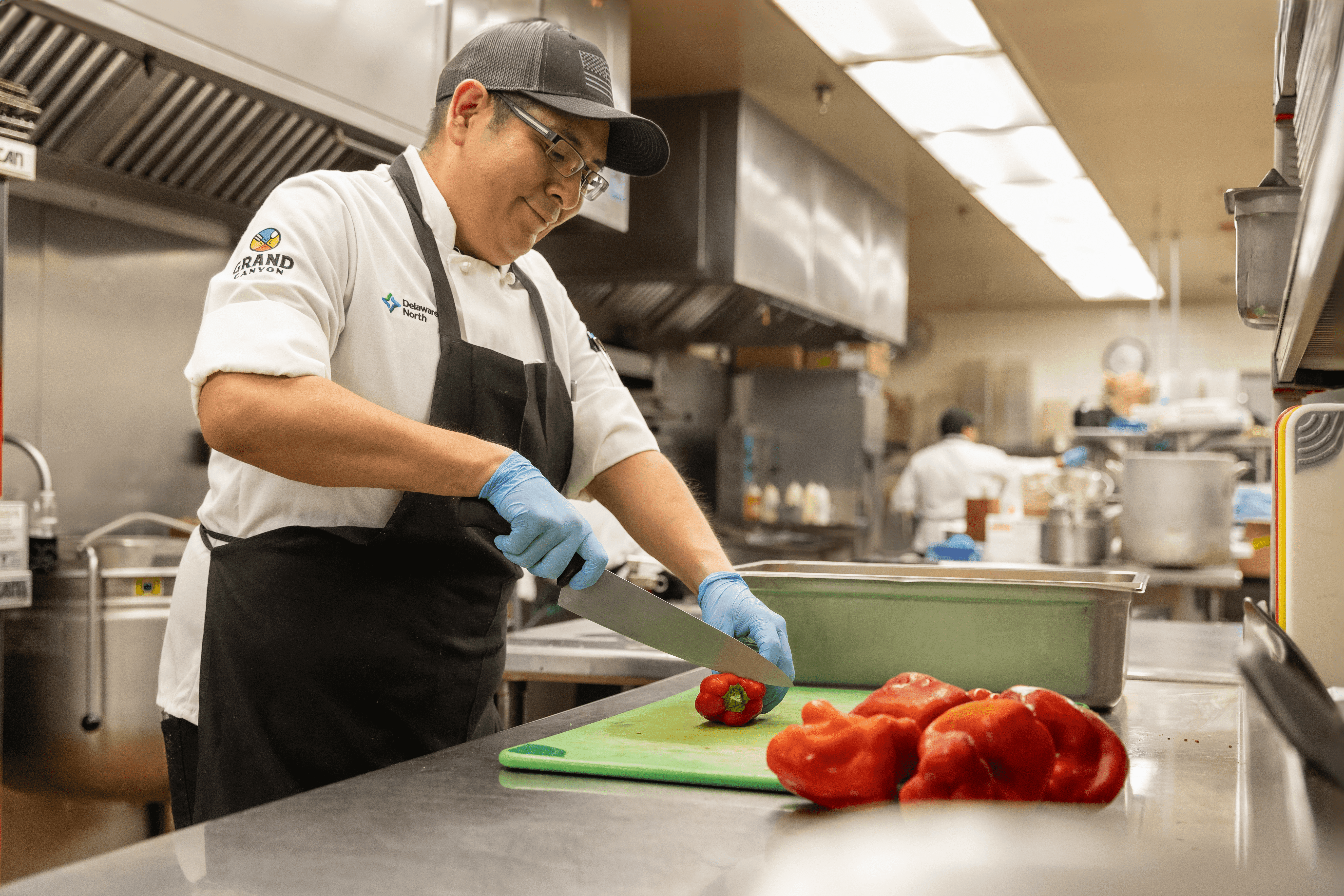 Chef prepping bell peppers