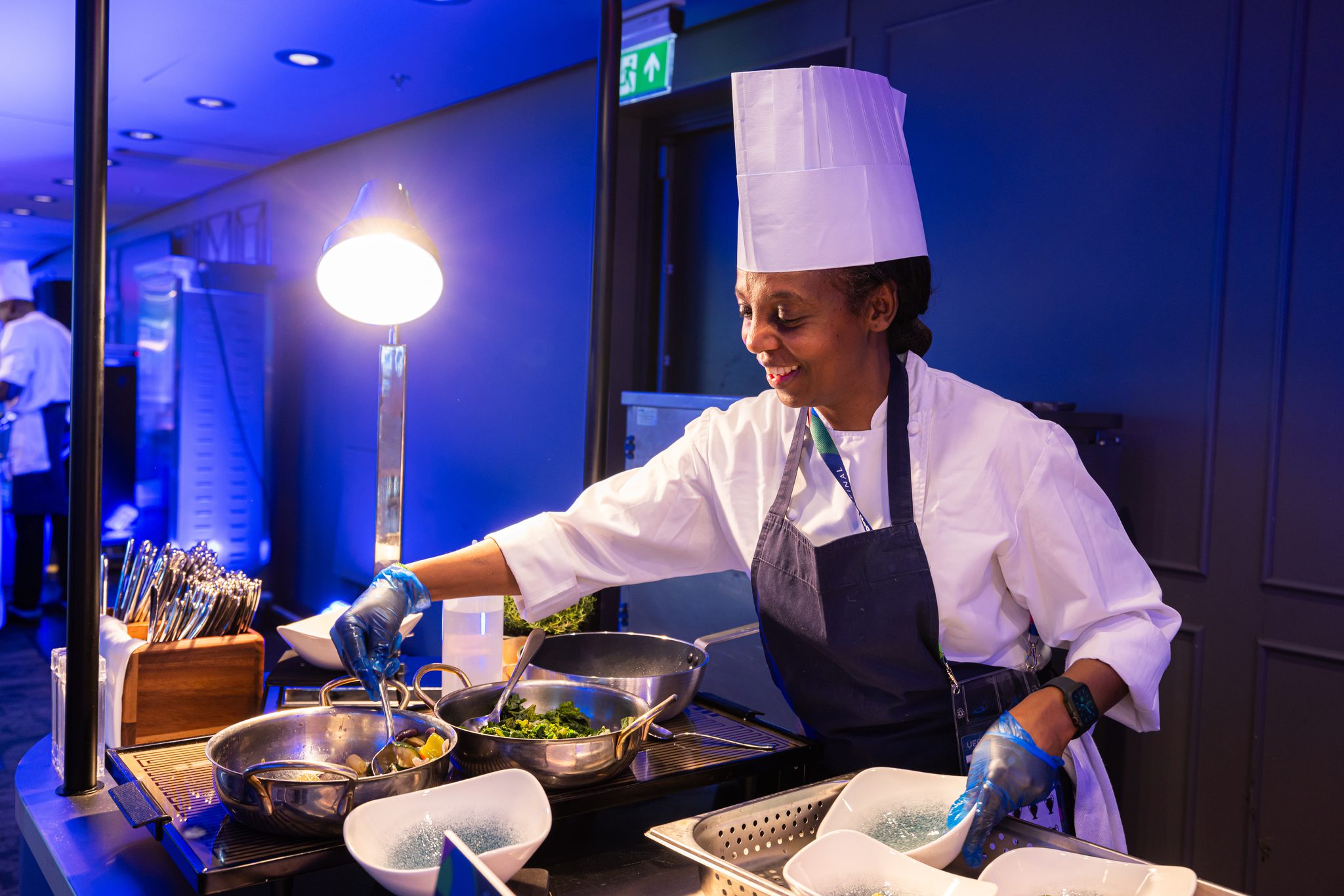 Chef plating dishes on buffet