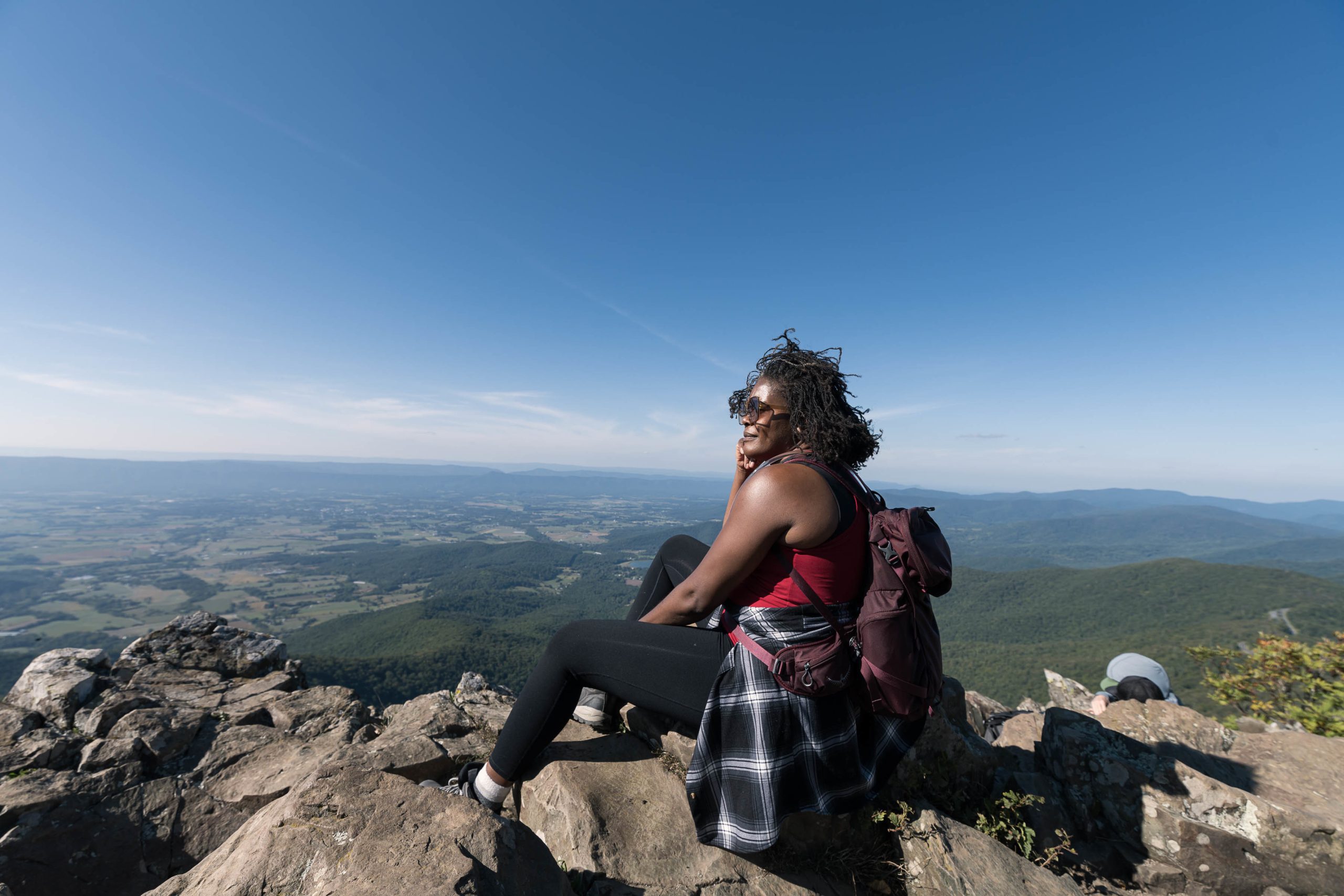 Shenandoah National Park Guest Sitting Hiker sitting admiring the view of Shenandoah National Park