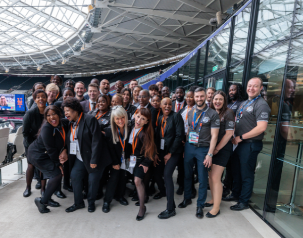 Group of London Stadium team members smiling for group photo